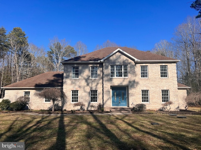 view of front of property with a front lawn