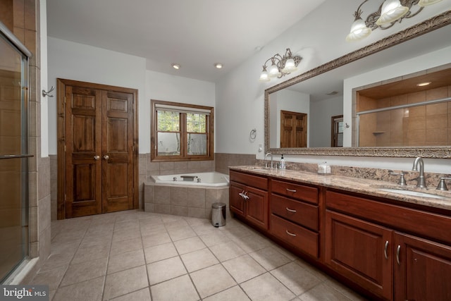 bathroom featuring vanity, tile patterned floors, and shower with separate bathtub