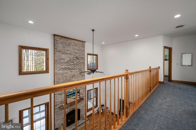 hallway with carpet floors