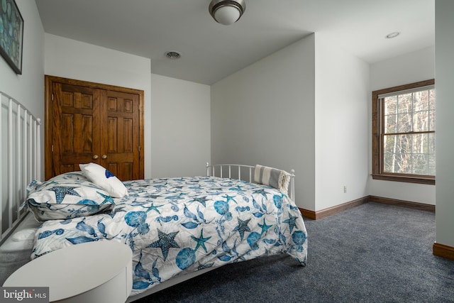 bedroom featuring dark carpet