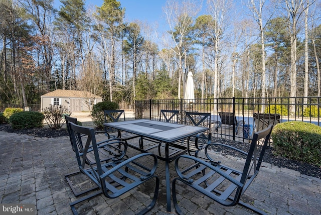 view of patio with a storage shed