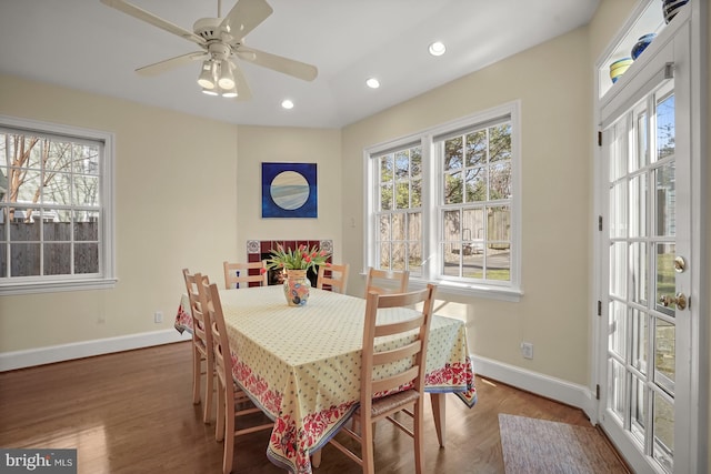 dining space with hardwood / wood-style flooring, a wealth of natural light, and ceiling fan