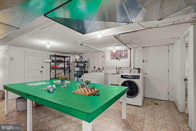 playroom featuring washing machine and dryer