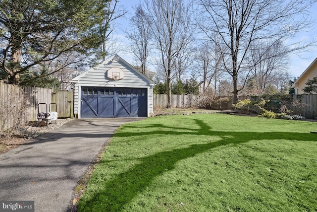 view of yard with a garage and an outdoor structure