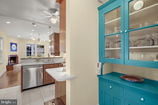 kitchen featuring pendant lighting, sink, stainless steel dishwasher, and ceiling fan