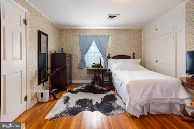 1308 Town Point Rd, Cambridge, MD 21613 - bedroom with crown molding and light hardwood / wood-style flooring