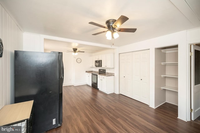 kitchen with ceiling fan, dark hardwood / wood-style floors, light stone countertops, black appliances, and white cabinets