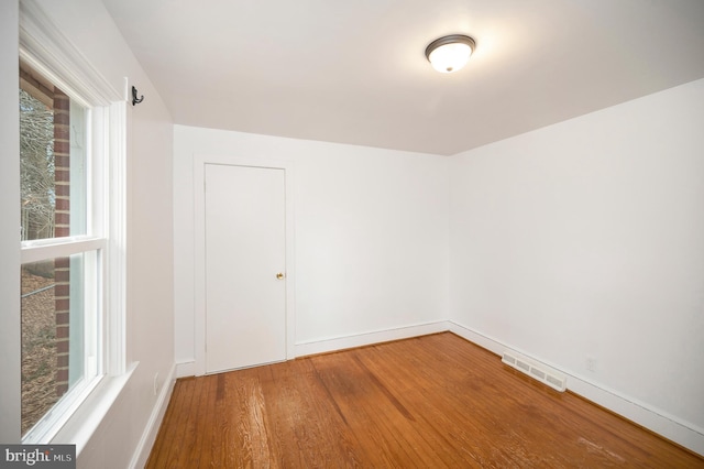 spare room featuring hardwood / wood-style flooring