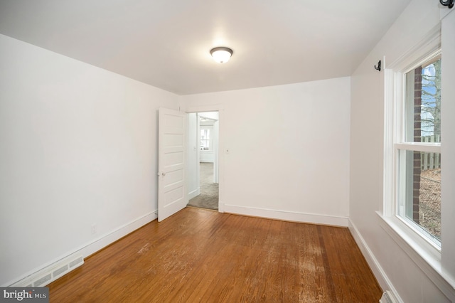 empty room featuring hardwood / wood-style floors