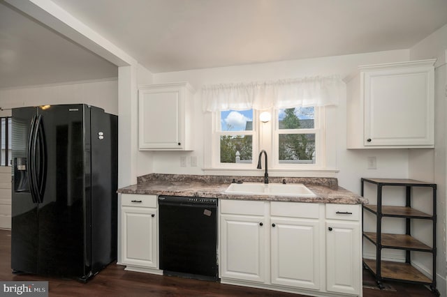 kitchen featuring white cabinetry, dark hardwood / wood-style flooring, sink, and black appliances