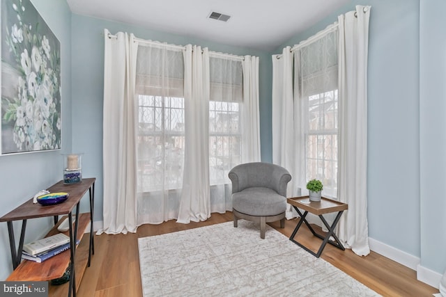 sitting room featuring hardwood / wood-style flooring