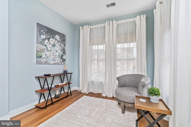 sitting room featuring hardwood / wood-style floors