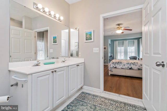 bathroom featuring ceiling fan, vanity, and tile patterned floors