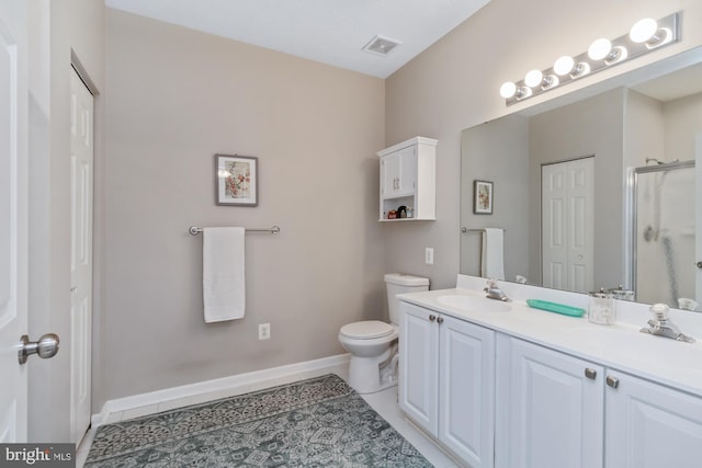 bathroom with vanity, toilet, an enclosed shower, and tile patterned flooring