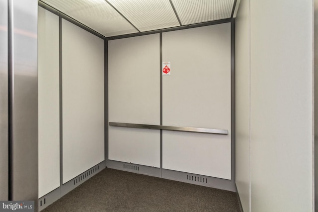 interior space with carpet and elevator