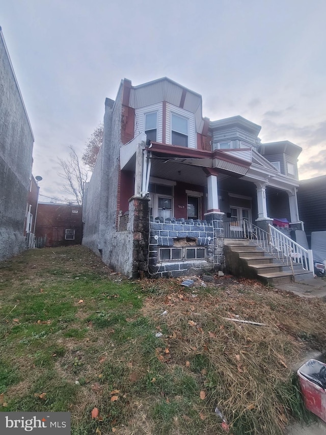 view of front of home featuring covered porch