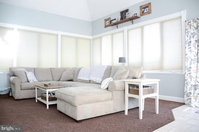 living room with lofted ceiling and carpet