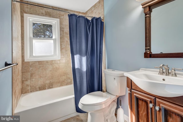 full bathroom featuring vanity, shower / bath combo with shower curtain, and toilet