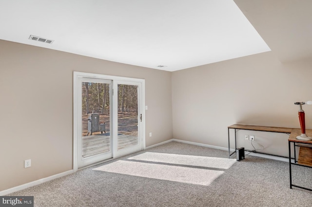 empty room featuring light colored carpet