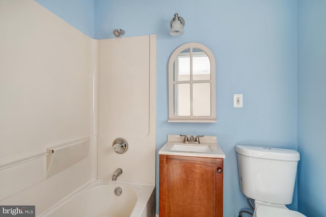 full bathroom with vanity,  shower combination, and toilet