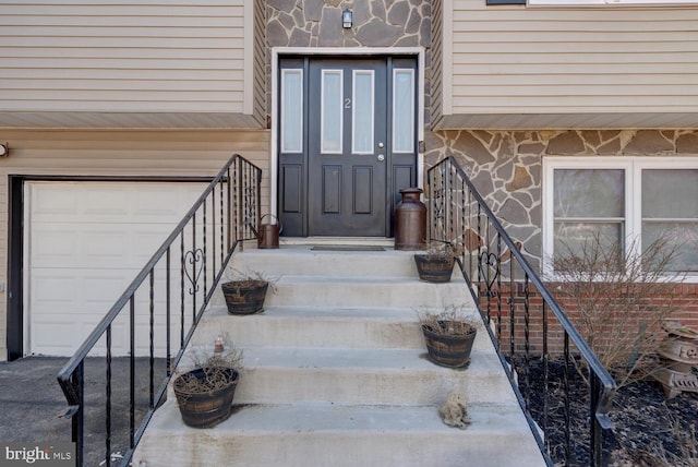 doorway to property featuring a garage