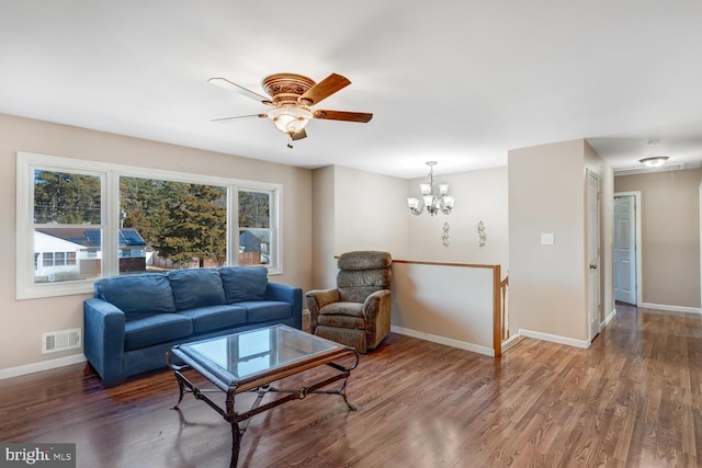 living room featuring dark hardwood / wood-style floors and ceiling fan