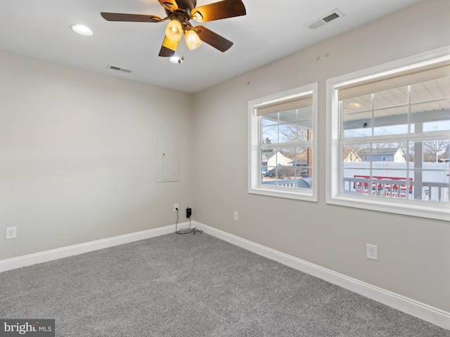 carpeted empty room featuring ceiling fan