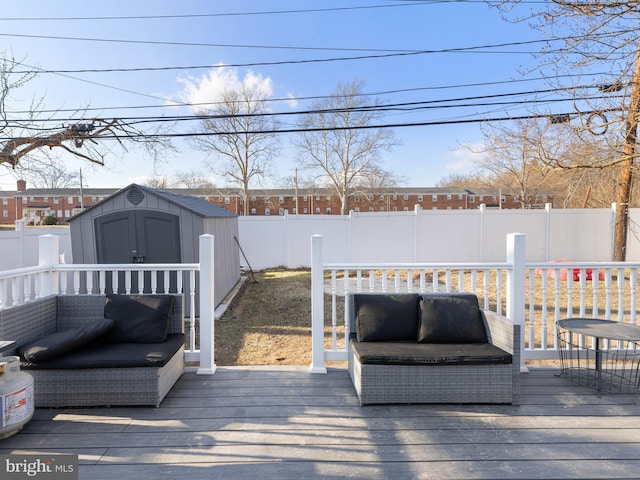 wooden terrace featuring a storage shed