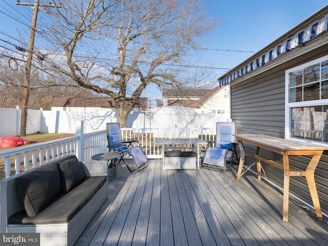 view of snow covered deck