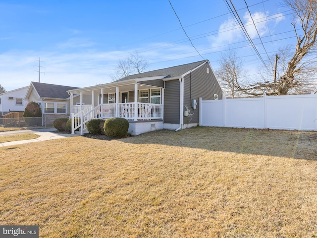 view of front facade with a front lawn and a porch