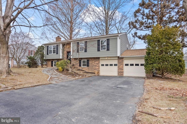 split foyer home featuring a garage