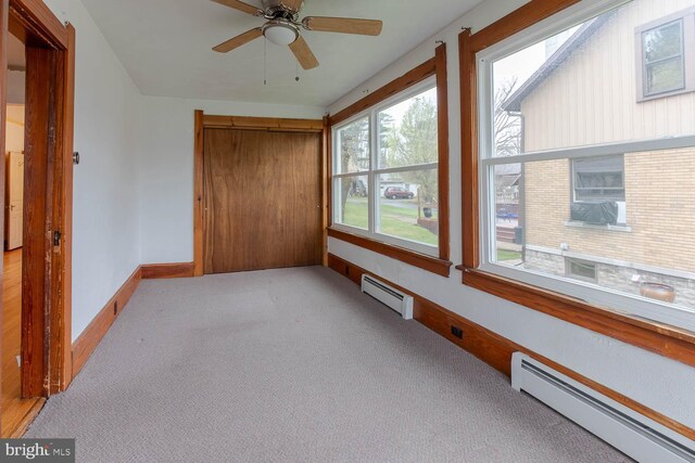 264 S Main St, Pleasant Gap, PA 16823 - unfurnished sunroom with a baseboard heating unit, carpet floors, and baseboards