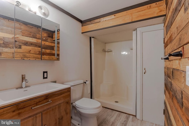 264 S Main St, Pleasant Gap, PA 16823 - full bath with a shower stall, wood finished floors, vanity, toilet, and visible vents