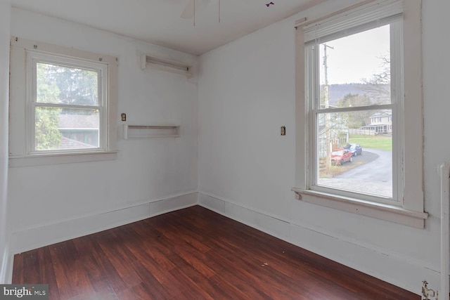264 S Main St, Pleasant Gap, PA 16823 - unfurnished room with dark wood finished floors and a ceiling fan