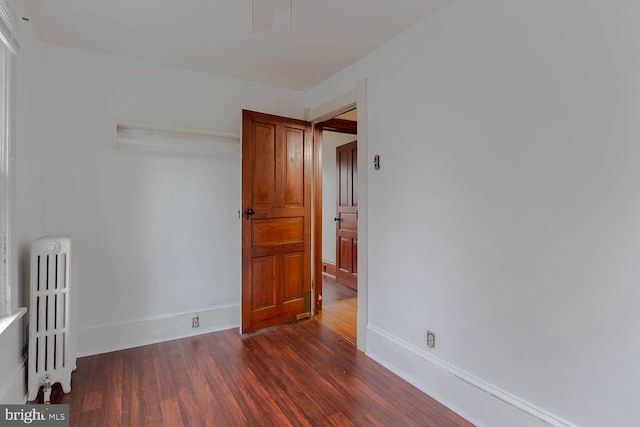 264 S Main St, Pleasant Gap, PA 16823 - unfurnished room with radiator, baseboards, and dark wood-type flooring