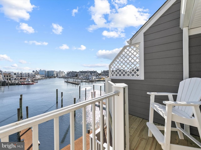 exterior space featuring a dock and a water view