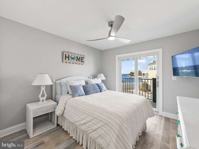 bedroom featuring hardwood / wood-style flooring, access to outside, and ceiling fan