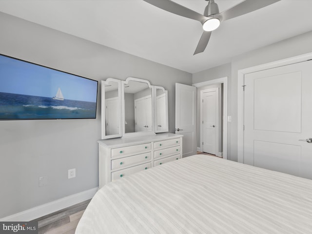 bedroom featuring light hardwood / wood-style floors and ceiling fan