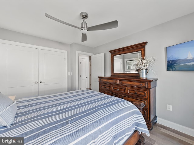 bedroom with a closet, ceiling fan, and light wood-type flooring