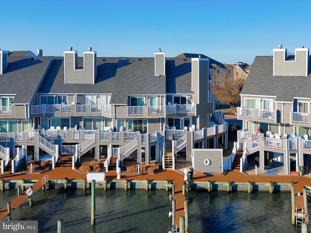 rear view of property featuring a water view