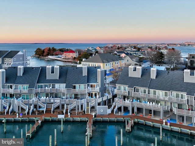 aerial view at dusk with a water view