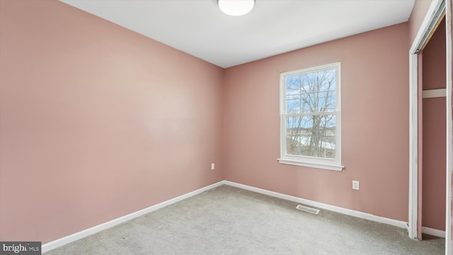 unfurnished bedroom with light colored carpet