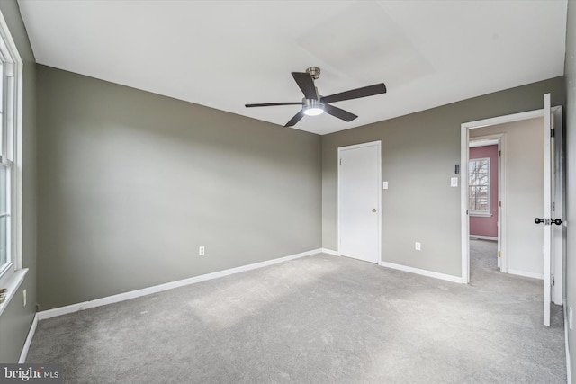 unfurnished bedroom with light colored carpet and ceiling fan