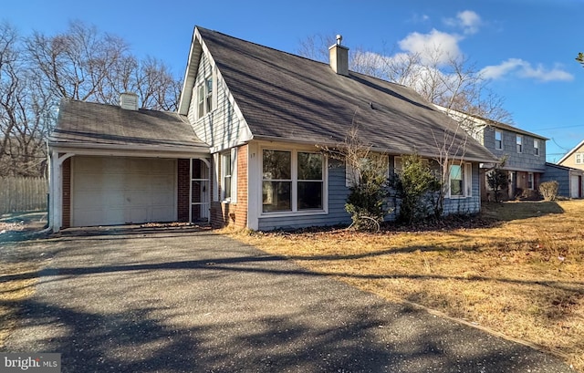 view of side of home featuring a garage