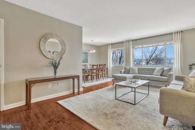 living room with dark hardwood / wood-style floors