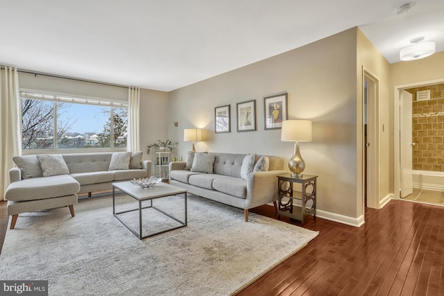 living room with dark hardwood / wood-style flooring