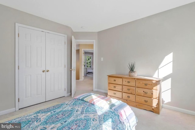 bedroom featuring a closet and baseboards