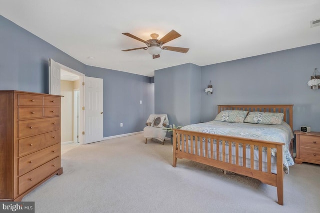 bedroom with light carpet, baseboards, visible vents, and a ceiling fan