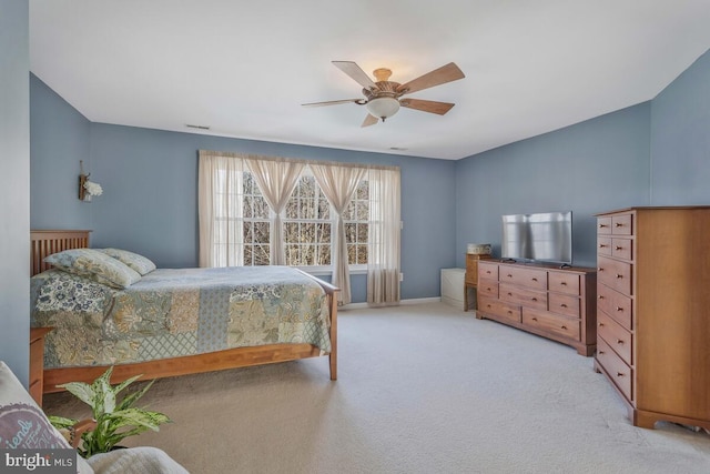 bedroom with baseboards, a ceiling fan, and light colored carpet