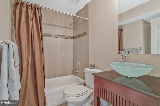 full bath with shower / bath combo, visible vents, vanity, and toilet